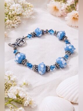 Blue Beaded Bracelet with White Florals and Heart & Anchor Closure